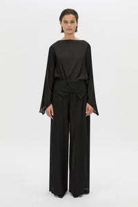 Front-styled view CAMILLA AND MARC long-sleeve Rene Draped Top in black with a boat neckline.