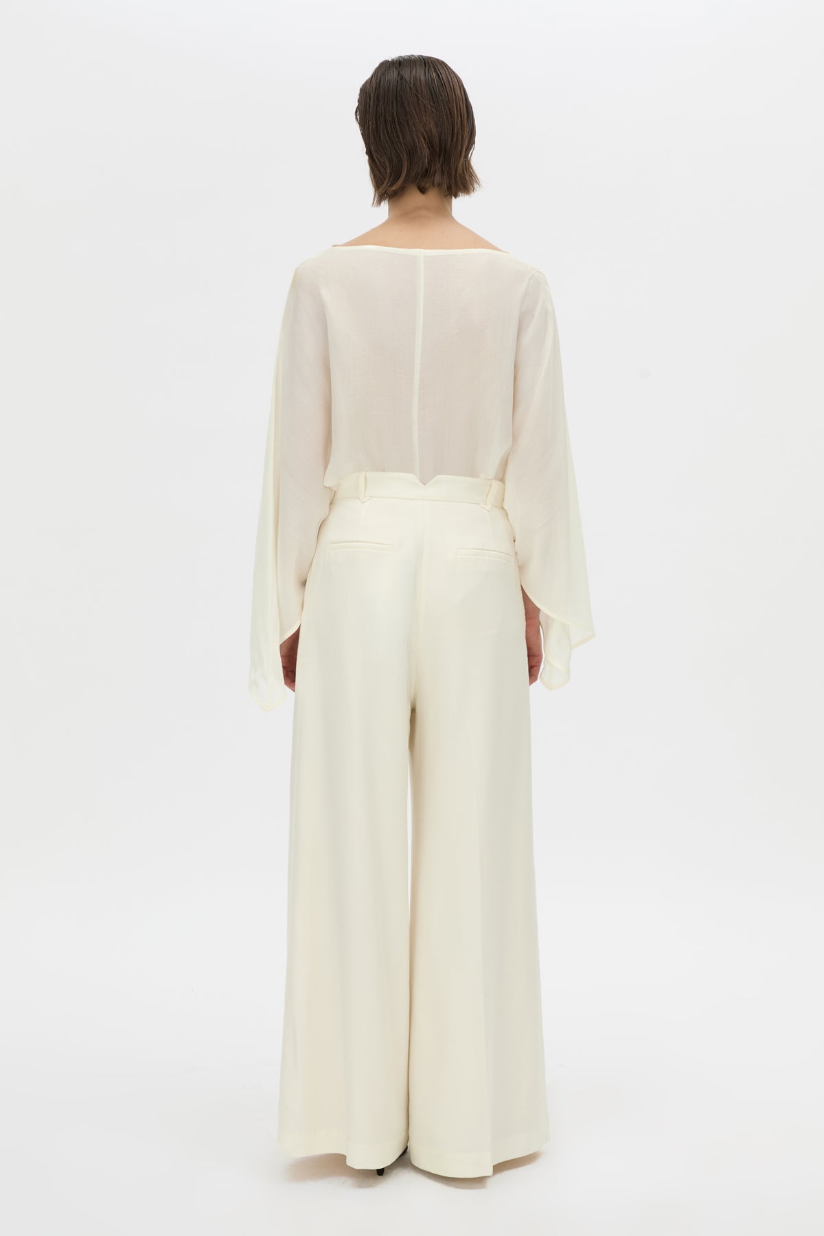 Back view CAMILLA AND MARC long-sleeve Rene Draped Top in cream with a boat neckline.