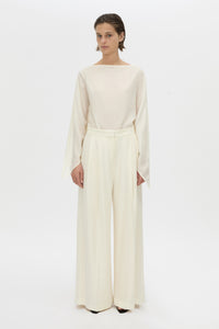 Front-styled view CAMILLA AND MARC long-sleeve Rene Draped Top in cream with a boat neckline.
