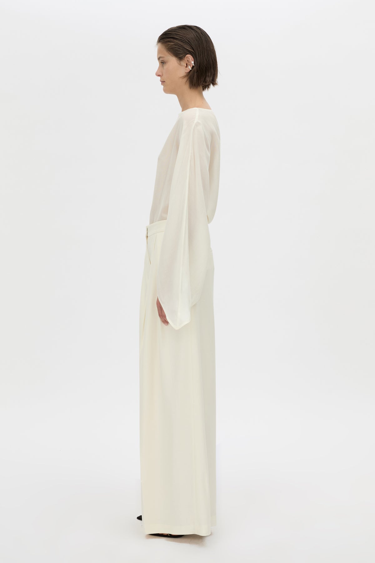 Side view CAMILLA AND MARC long-sleeve Rene Draped Top in cream with a boat neckline.