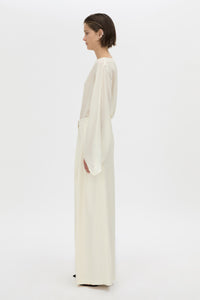 Side view CAMILLA AND MARC long-sleeve Rene Draped Top in cream with a boat neckline.