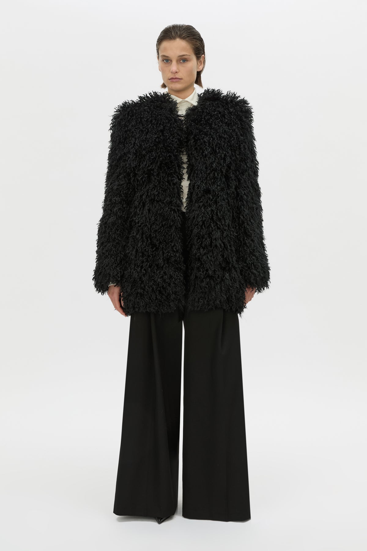 Front-styled view CAMILLA AND MARC oversized Renley Short Coat in black faux‑fur.