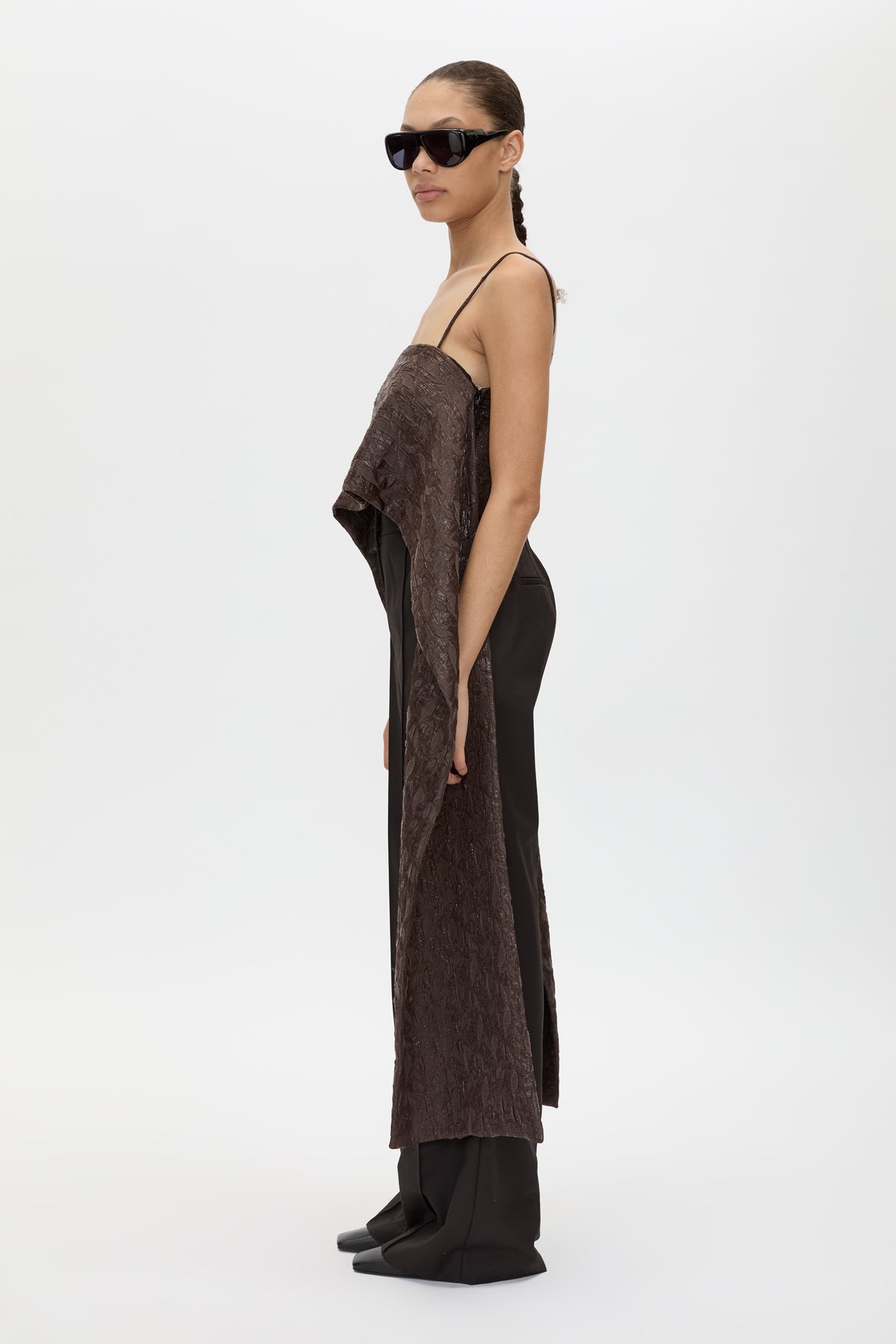Side view CAMILLA AND MARC Rennick Cami Top in Chocolate with thin straps, cropped front hem and long draped back panels.