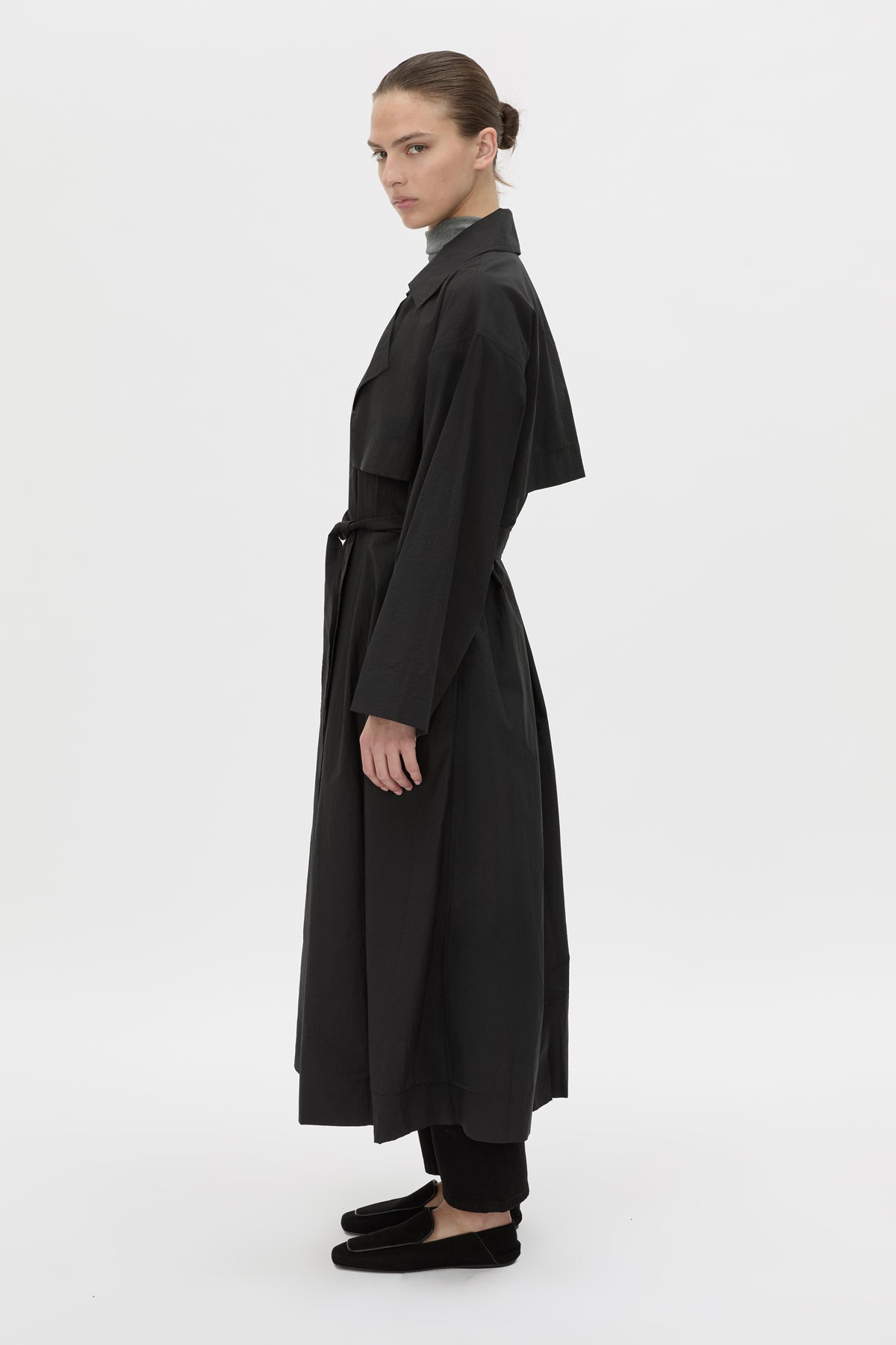 Side view CAMILLA AND MARC Rhia Sheer Full Length Trench in black with a relaxed fit.