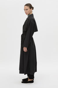 Side view CAMILLA AND MARC Rhia Sheer Full Length Trench in black with a relaxed fit.