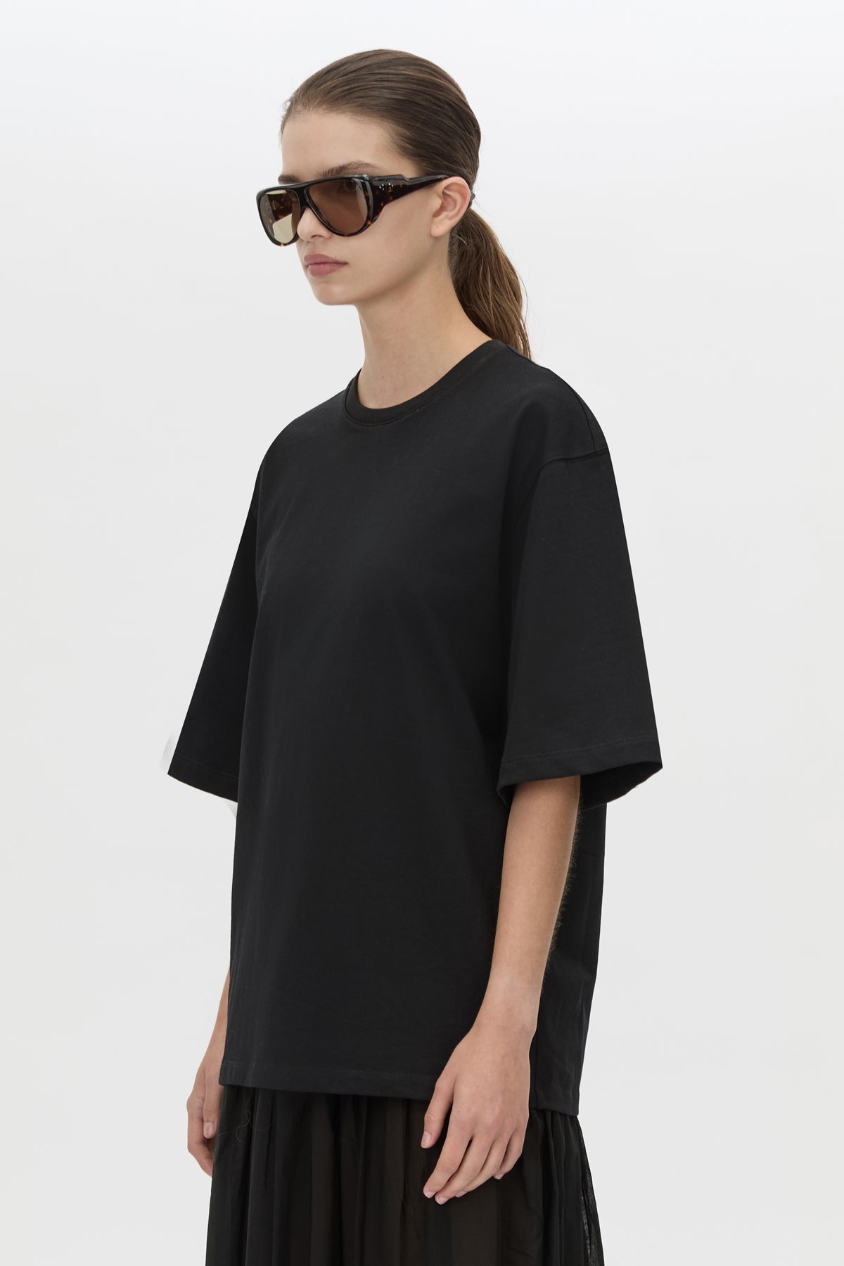 Cropped view CAMILLA AND MARC Romy Contrast Maxi Dress in black with upper cotton tee‑shirt and sheer voile extension.
