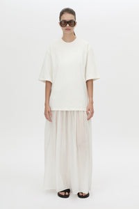 Front-styled view CAMILLA AND MARC Romy Contrast Maxi Dress in soft white with upper cotton tee‑shirt and sheer voile extension.