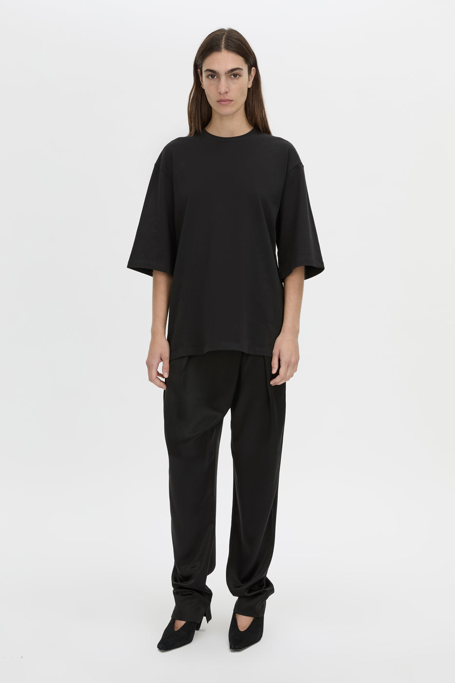 Front-styled view CAMILLA AND MARC Romy Oversized Tee in black with tubular ribbed bound neckline.