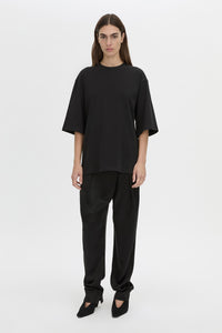 Front-styled view CAMILLA AND MARC Romy Oversized Tee in black with tubular ribbed bound neckline.