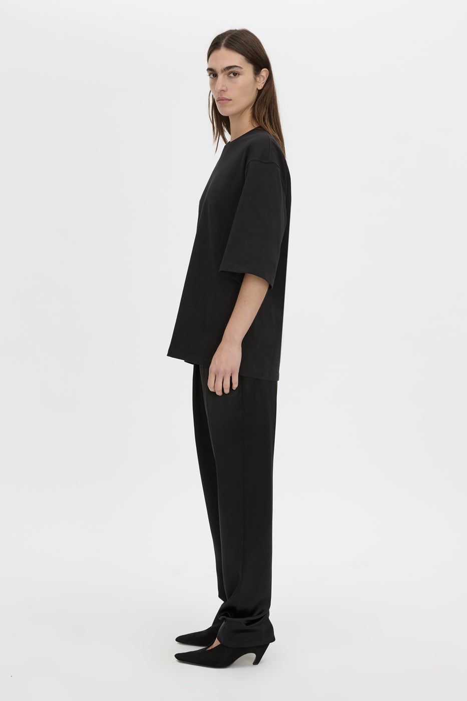 Side view CAMILLA AND MARC Romy Oversized Tee in black with tubular ribbed bound neckline.