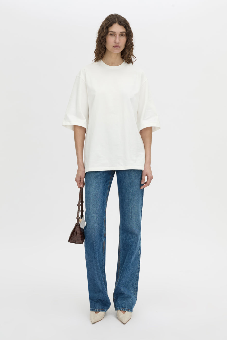 Front-styled view CAMILLA AND MARC Romy Oversized Tee in white with tubular ribbed bound neckline.