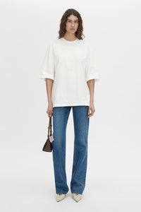 Front-styled view CAMILLA AND MARC Romy Oversized Tee in white with tubular ribbed bound neckline.