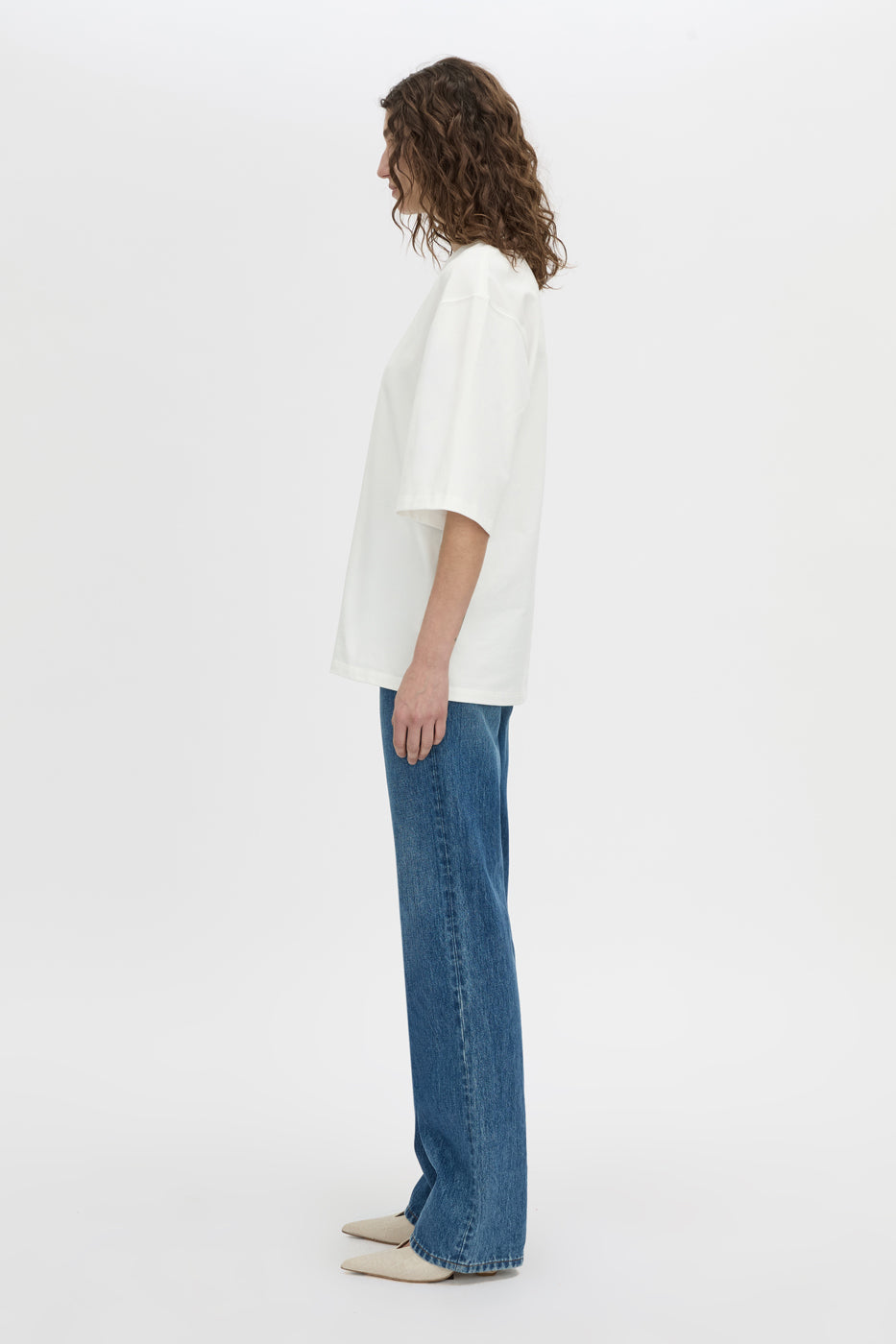 Side view CAMILLA AND MARC Romy Oversized Tee in white with tubular ribbed bound neckline.