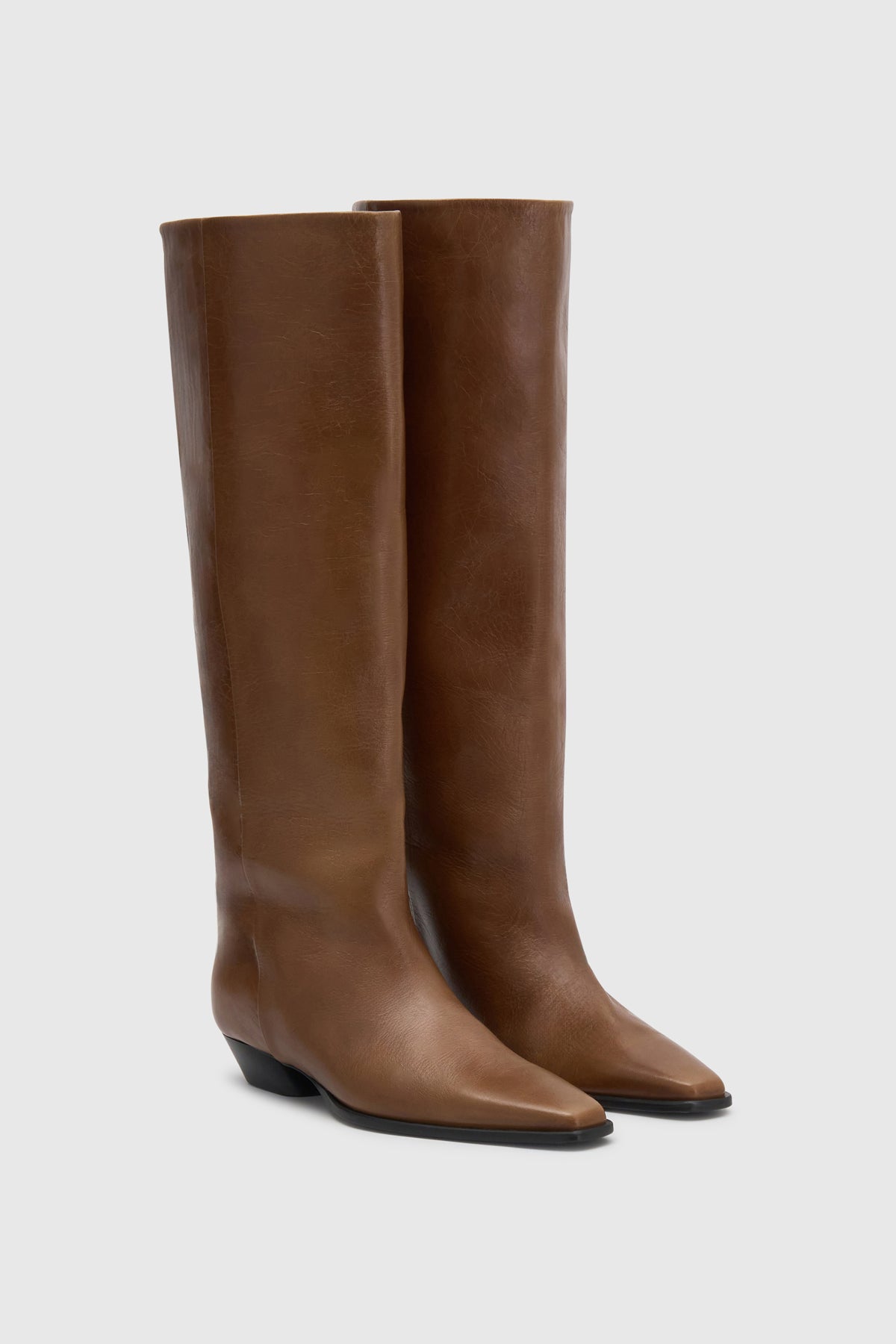 Three-quarter view CAMILLA AND MARC Rowan Knee Boot in Tan tumbled‑look Italian leather.