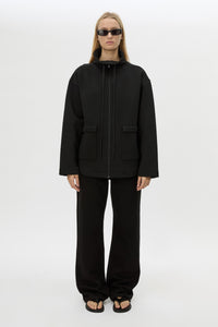 Front styled view CAMILLA AND MARC Salem Bonded Fleece Jacket in black with high collared neckline.