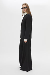 Side View CAMILLA AND MARC San fitted collarless blazer in black with Front button closure.