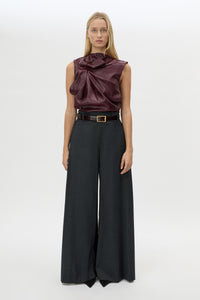 Front styled view CAMILLA AND MARC Sana Tailored Top in Burgundy with draped detailing and a high neckline.