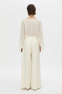 Styled view CAMILLA AND MARC high-waisted Selin Suit Pant in cream.