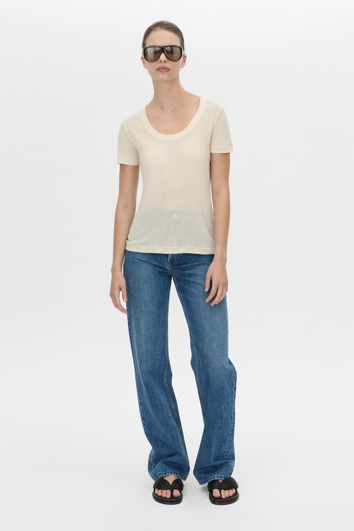 Front-styled view CAMILLA AND MARC Siona Light Weight Fitted Tee in cream with scoop neckline.