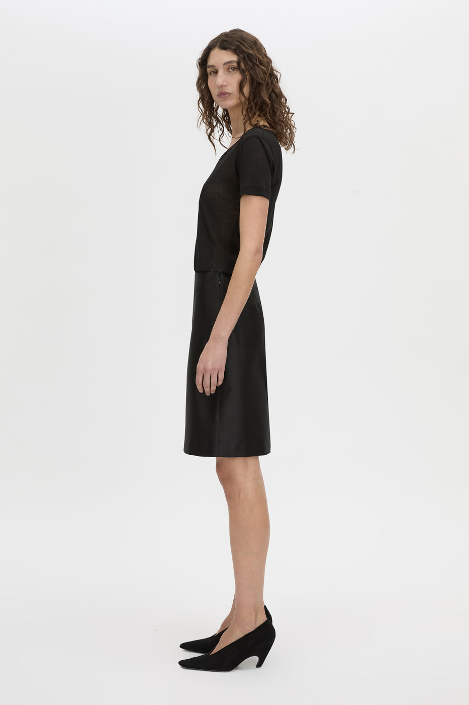 Side view CAMILLA AND MARC Siona Light Weight Fitted Tee in black with scoop neckline.