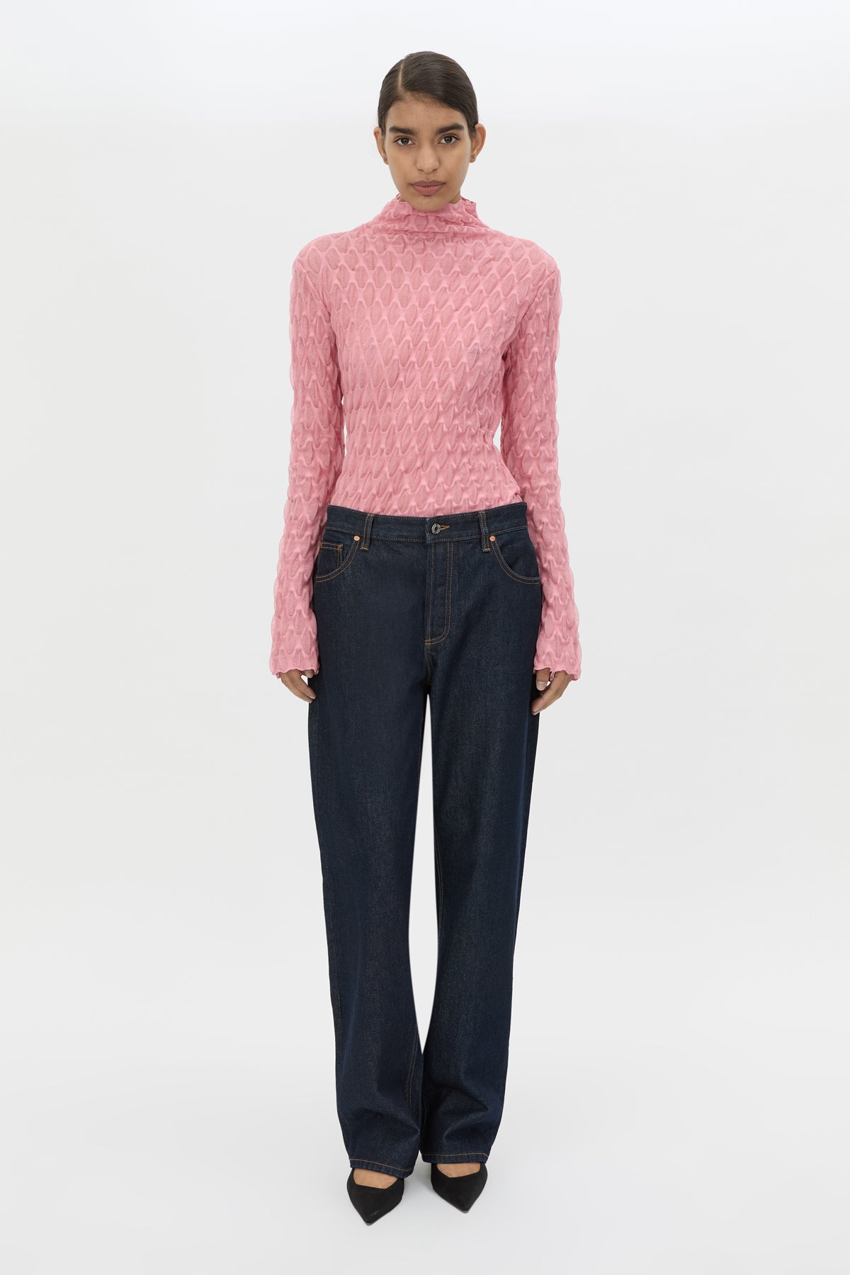 Front styled view CAMILLA AND MARC Sissil Top in Powder Pink jersey with long sleeves and funnel neck.