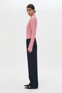 Side view CAMILLA AND MARC Sissil Top in Powder Pink jersey with long sleeves and funnel neck.