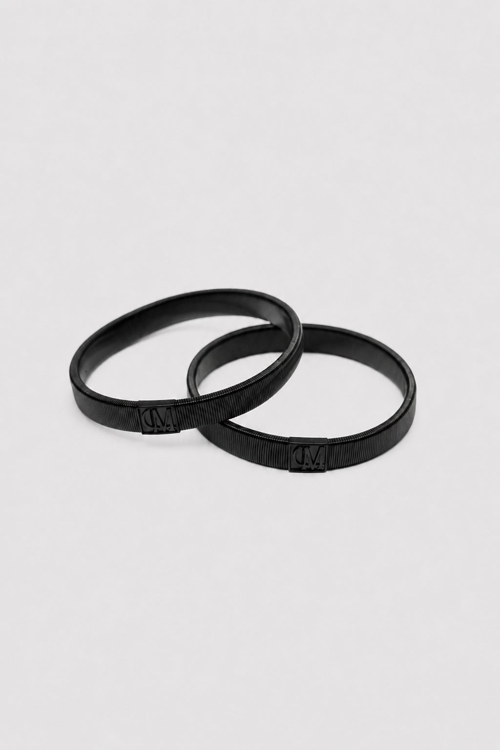 Ghost View - CAMILLA AND MARC Sleeve Monogram garter pair in black. Worn on the arm to perfectly bunch up any sleeve.