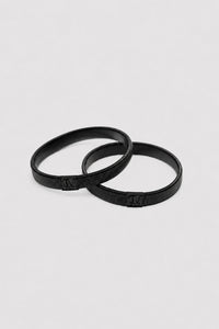 Ghost View - CAMILLA AND MARC Sleeve Monogram garter pair in black. Worn on the arm to perfectly bunch up any sleeve.