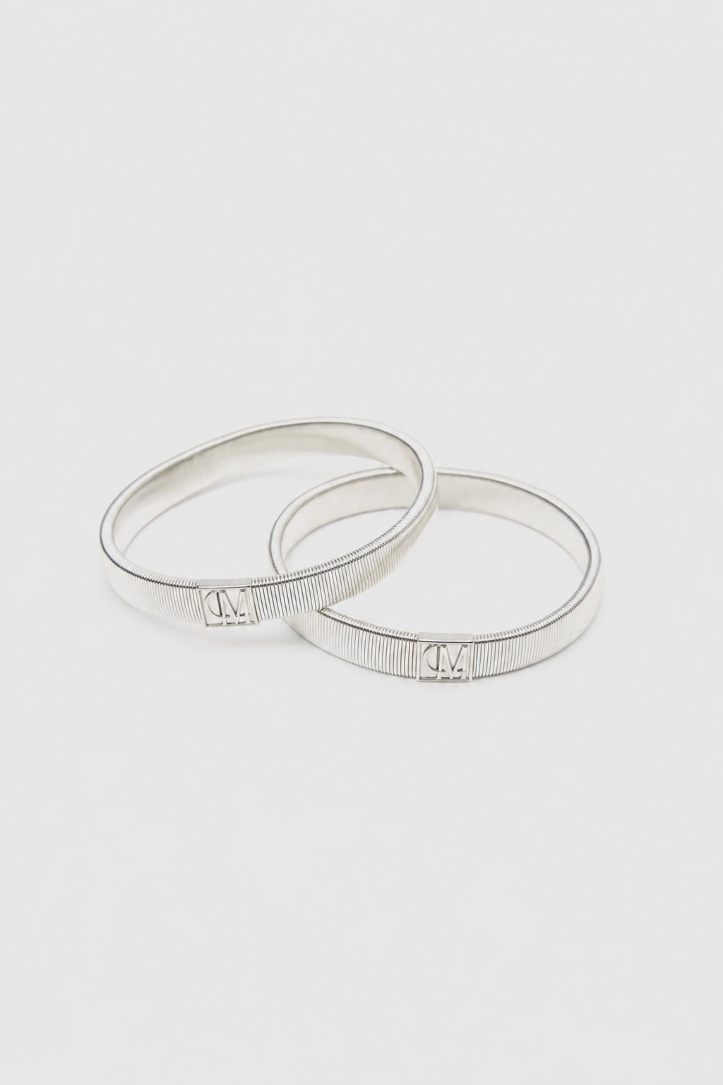 Ghost View - CAMILLA AND MARC Sleeve Monogram garter pair in silver. Wear with your favourite shirt, blazer, or coat.