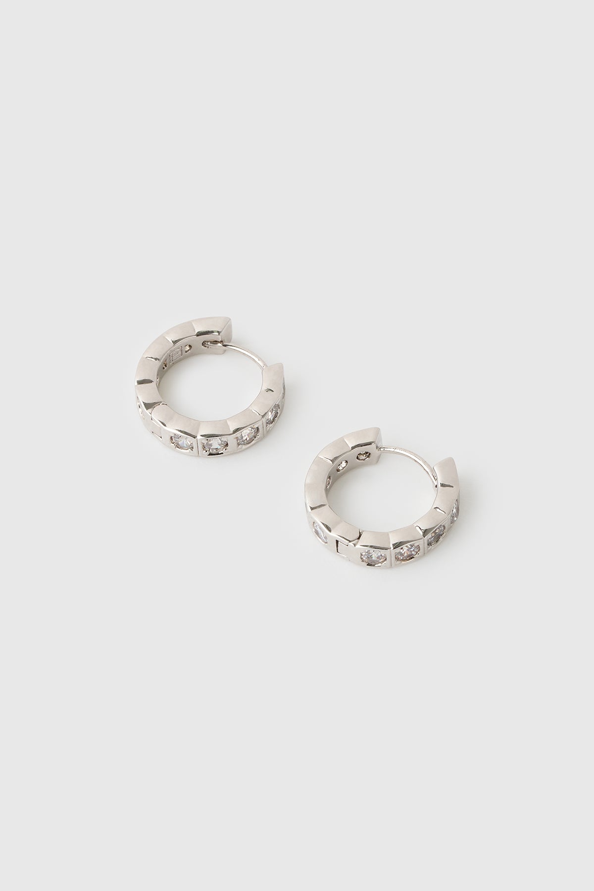 Three-quarter view CAMILLA AND MARC Sloane Huggies in Silver rhodium plating.