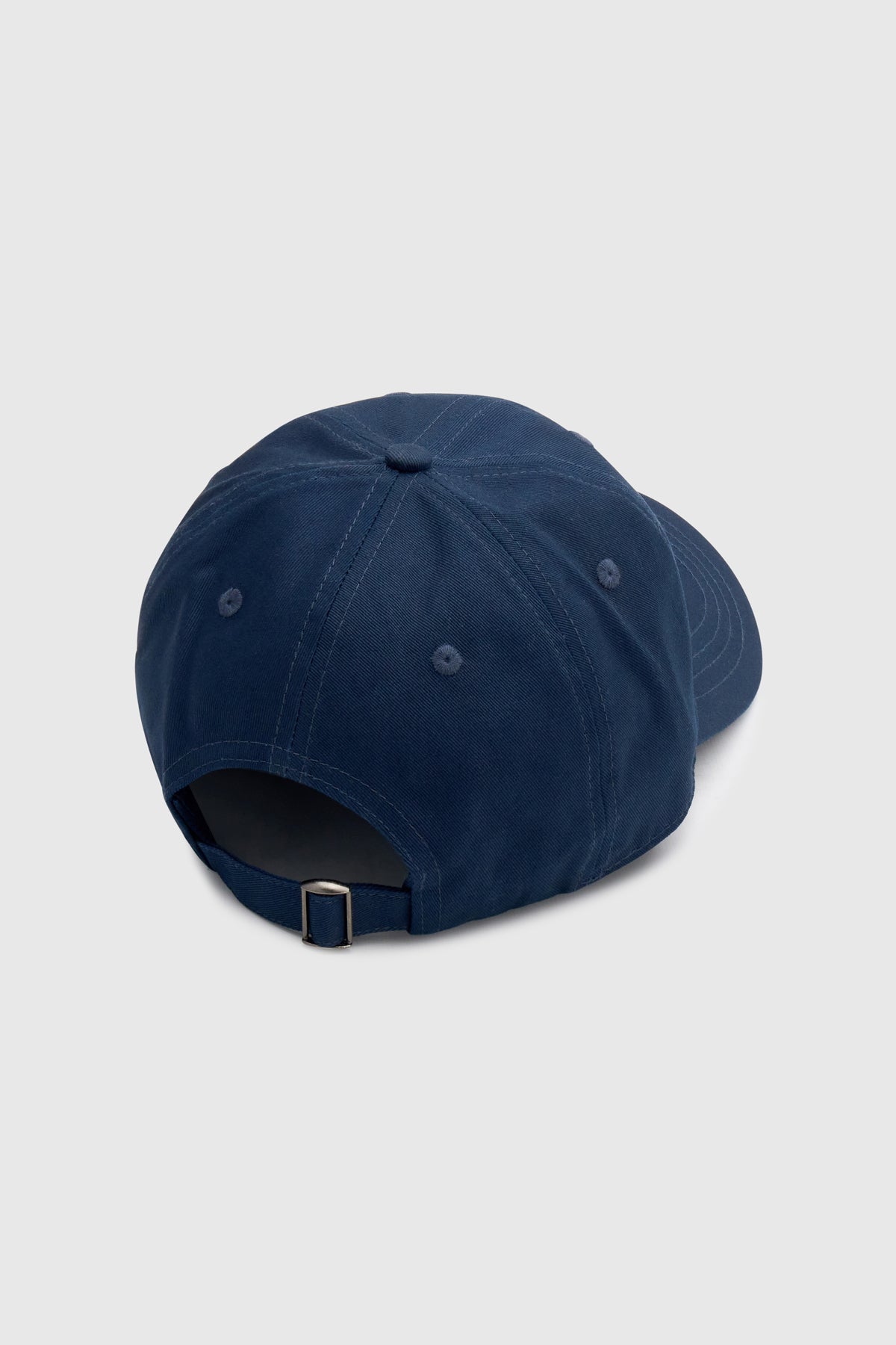 Back view CAMILLA AND MARC Sonora Embroidered Logo Cap in Deep Ink with embroidered artwork.