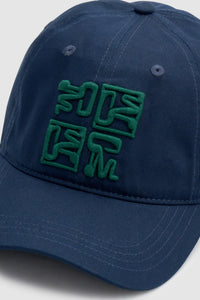 Cropped view CAMILLA AND MARC Sonora Embroidered Logo Cap in Deep Ink with embroidered artwork.