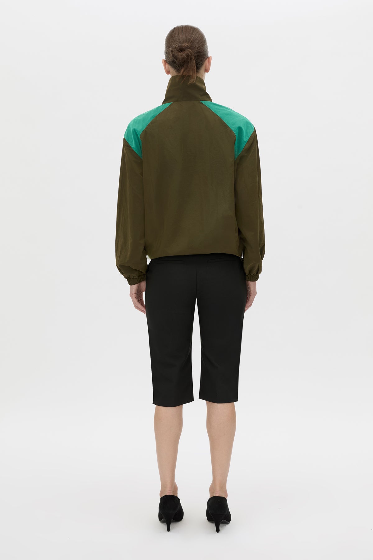 Back view CAMILLA AND MARC Storm Colour Block Anorak in khaki emerald with contrast shoulder panels and a funnel neckline.