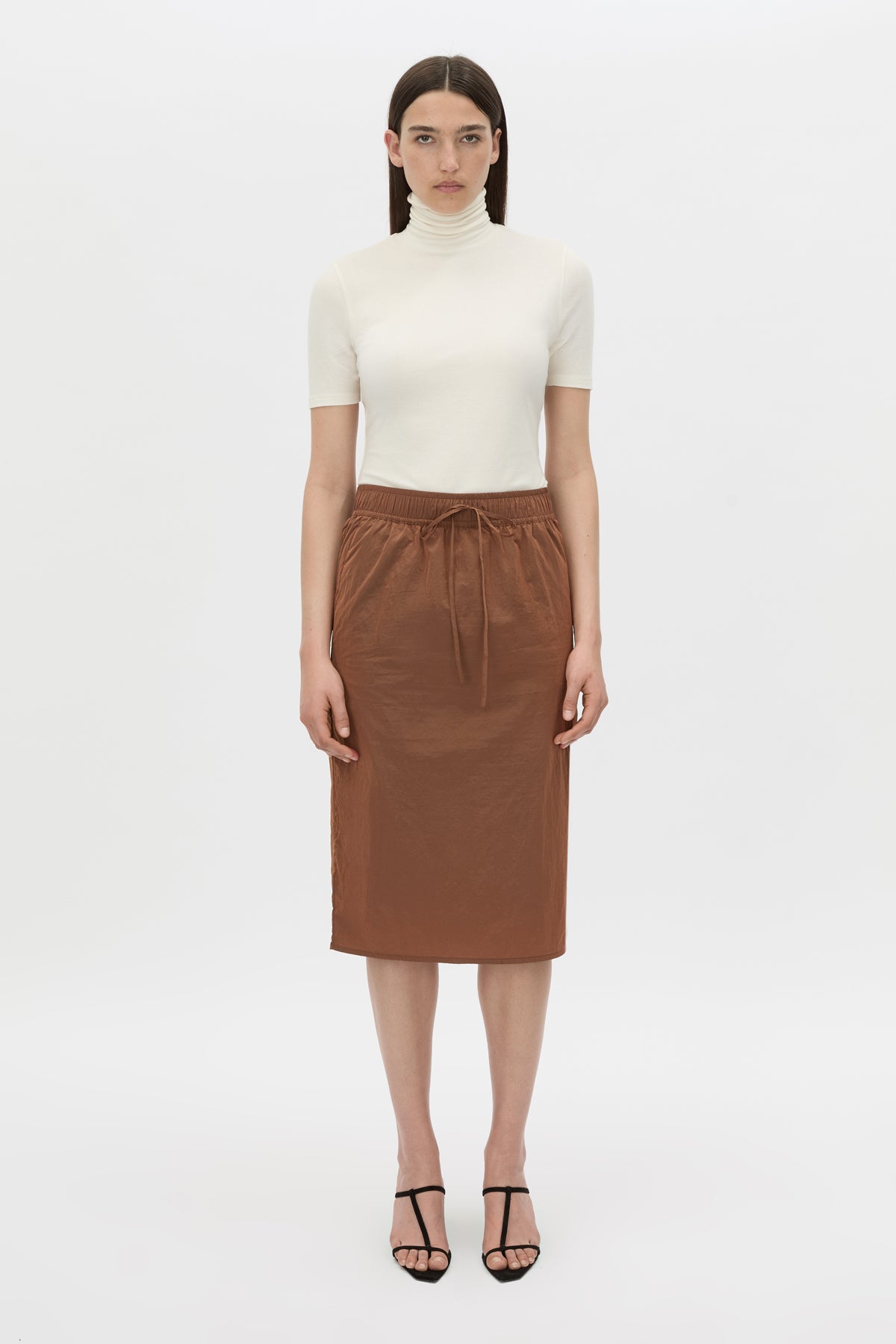 Front view CAMILLA AND MARC Storm Midi Skirt in mocha with an elasticated waistband, slanted side pockets and a back vent.
