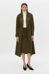 Front-styled view CAMILLA AND MARC Storm Trench Coat in khaki with concealed snap fastenings, in seam pockets and a self tie belt with sleeve straps.