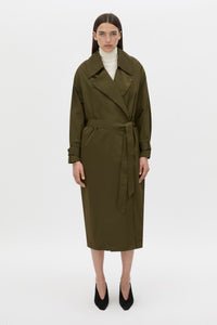 Styled view CAMILLA AND MARC Storm Trench Coat in khaki with concealed snap fastenings, in seam pockets and a self tie belt with sleeve straps.