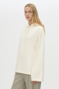 Cropped view CAMILLA AND MARC Studio Hoodie in White with relaxed long‑sleeve design and hooded silhouette.  