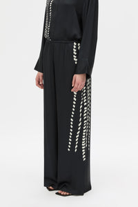 Cropped view CAMILLA AND MARC Suri Wide-Leg Pant in black suri print with mid‑rise fit.