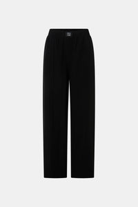 Ghost view CAMILLA AND MARC Sylvia soft suiting high-waisted pant in black with monogram patch at waistband.