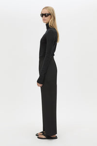 Side view CAMILLA AND MARC Sylvia soft suiting high-waisted pant in black with monogram patch at waistband.