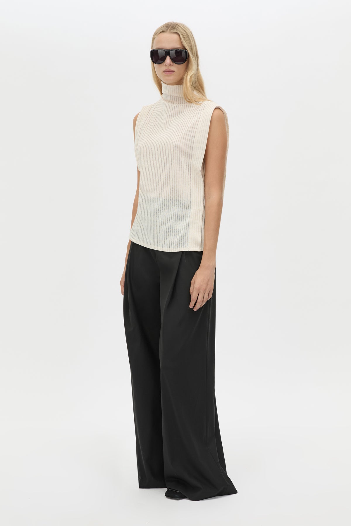 Three-quarter view CAMILLA AND MARC Talo Jersey Top in Cream with a boxy sleeveless cut.