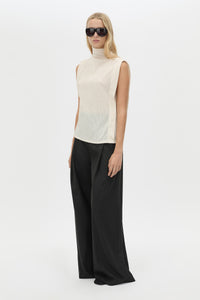 Three-quarter view CAMILLA AND MARC Talo Jersey Top in Cream with a boxy sleeveless cut.