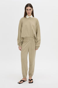 Front-styled view CAMILLA AND MARC Thome Emb Track Pant in garment-dyed oyster.