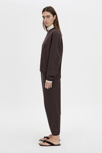 Side view CAMILLA AND MARC Thome Emb Relaxed Track Top in garment-dyed hickory.