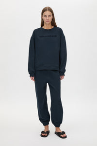 Front view CAMILLA AND MARC Tia Flocking Logo Crew in Deep Ink with relaxed fit, logo artwork and 100% cotton.