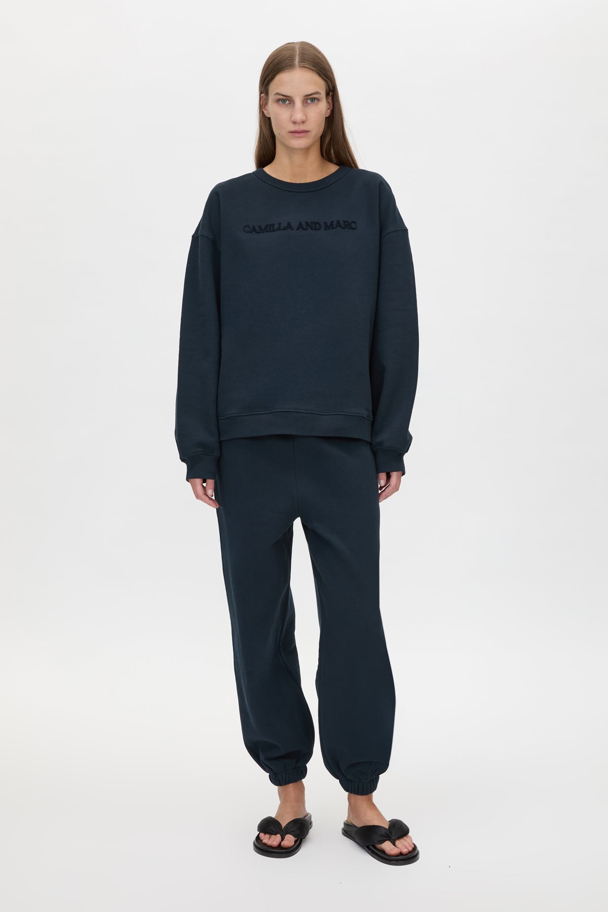 Front view CAMILLA AND MARC Tia Flocking Logo Crew in Deep Ink with relaxed fit, logo artwork and 100% cotton.