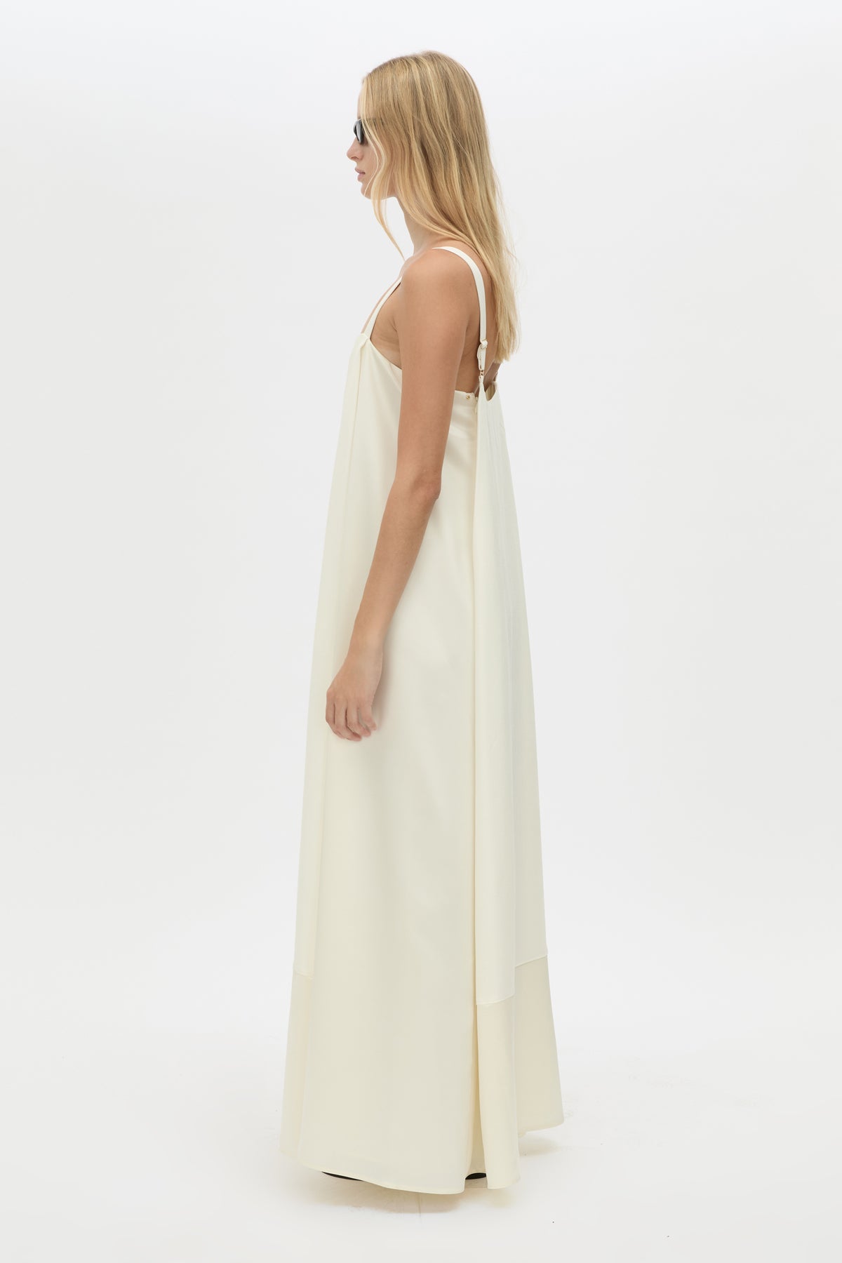 Side view CAMILLA AND MARC Tove Maxi Dress in Cream with a sleeveless silhouette and contrasting satin trim. 