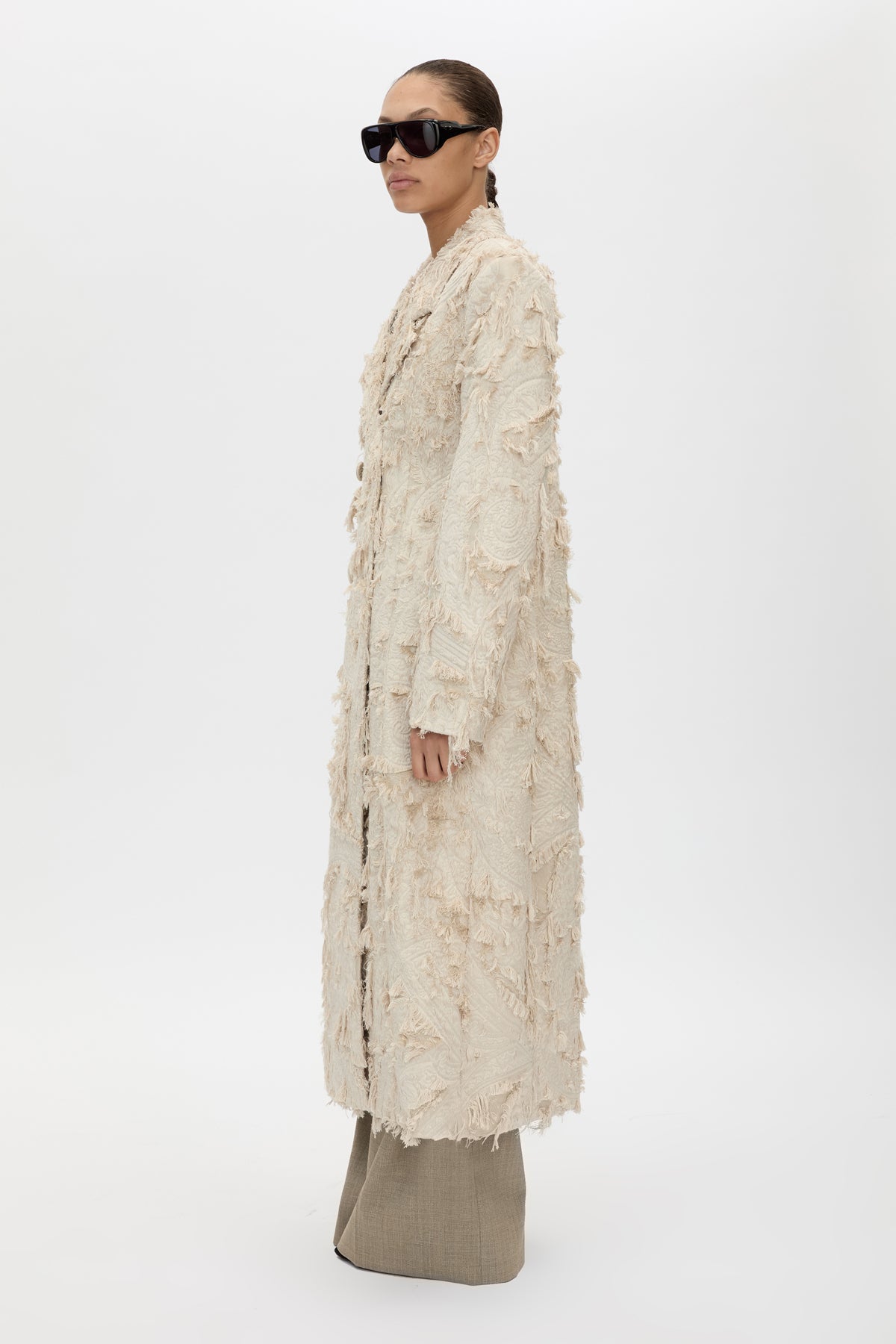 Side view CAMILLA AND MARC Tundra Double Breasted Coat in Stone with exaggerated shoulders, fitted waist and jacquard floral texture.