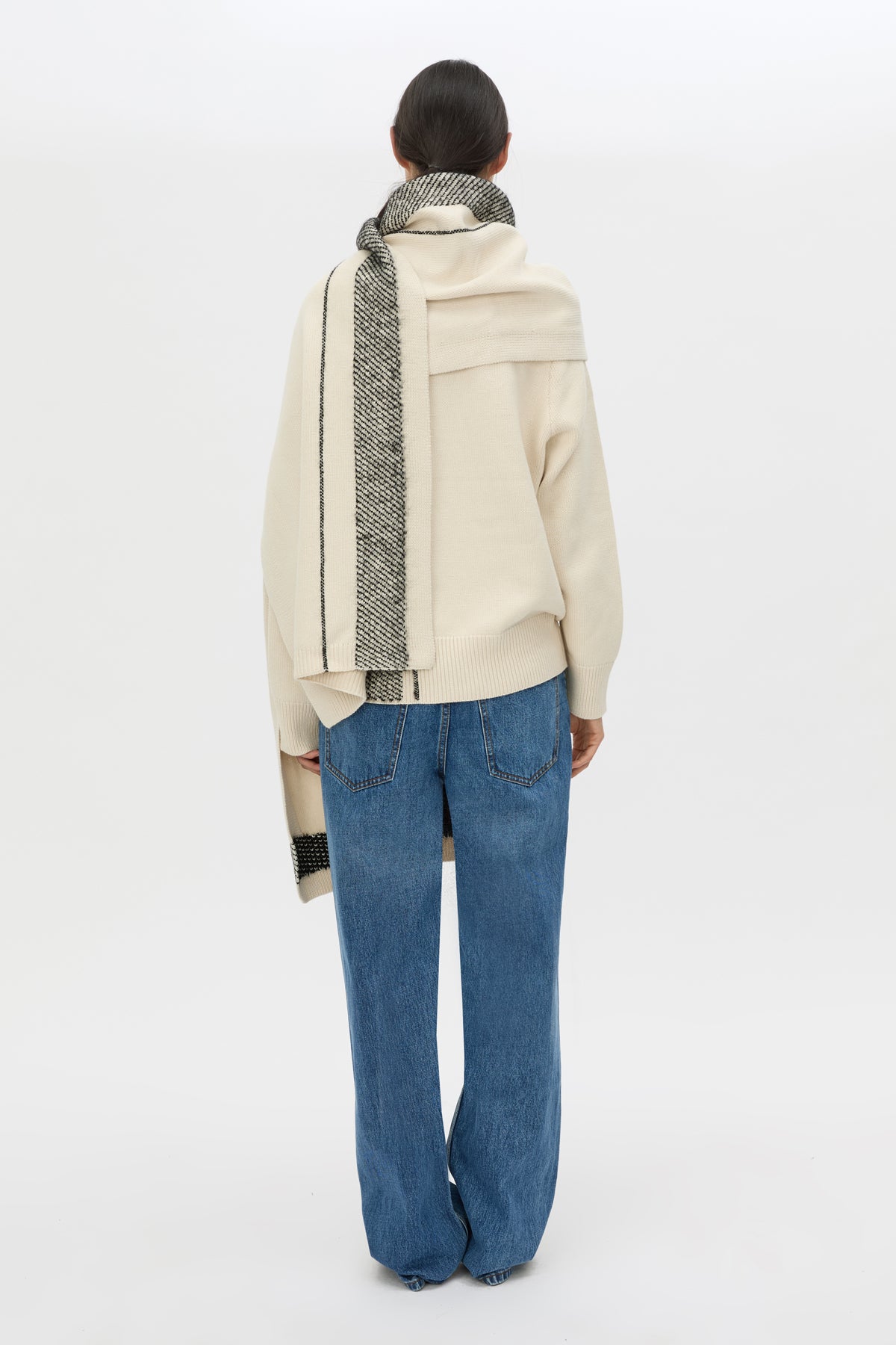 Back view CAMILLA AND MARC Tusk Knit Stripe Scarf in Black with striped jacquard graphic and Australian wool fabrication.