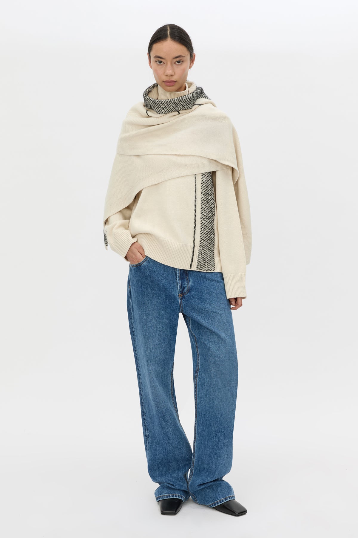 Front styled view CAMILLA AND MARC Tusk Knit Stripe Scarf in Black with striped jacquard graphic and Australian wool fabrication.